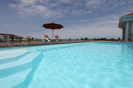 Experience ultimate relaxation with this pristine San Juan fiberglass pool, nestled in a picturesque coastal setting.