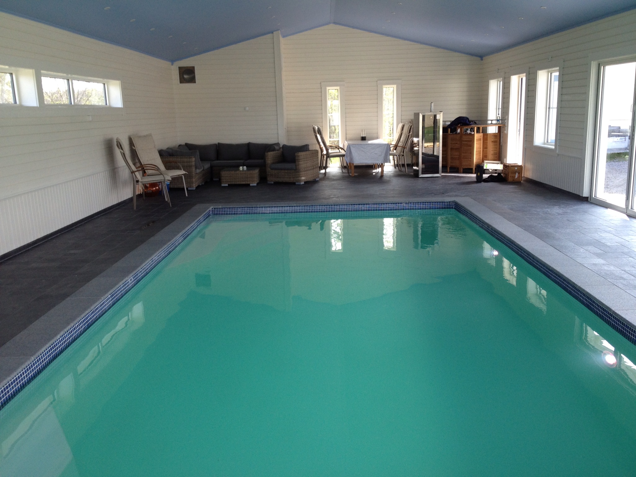 Experience the pristine clarity of our fiberglass indoor pool—clean, inviting, and ready for relaxation.