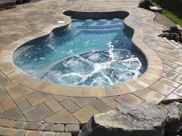 Experience ultimate relaxation in our beautifully crafted fiberglass hot tub, seamlessly integrated into your backyard oasis. The natural stone tiles and surrounding greenery create a tranquil, spa-like atmosphere perfect for unwinding.