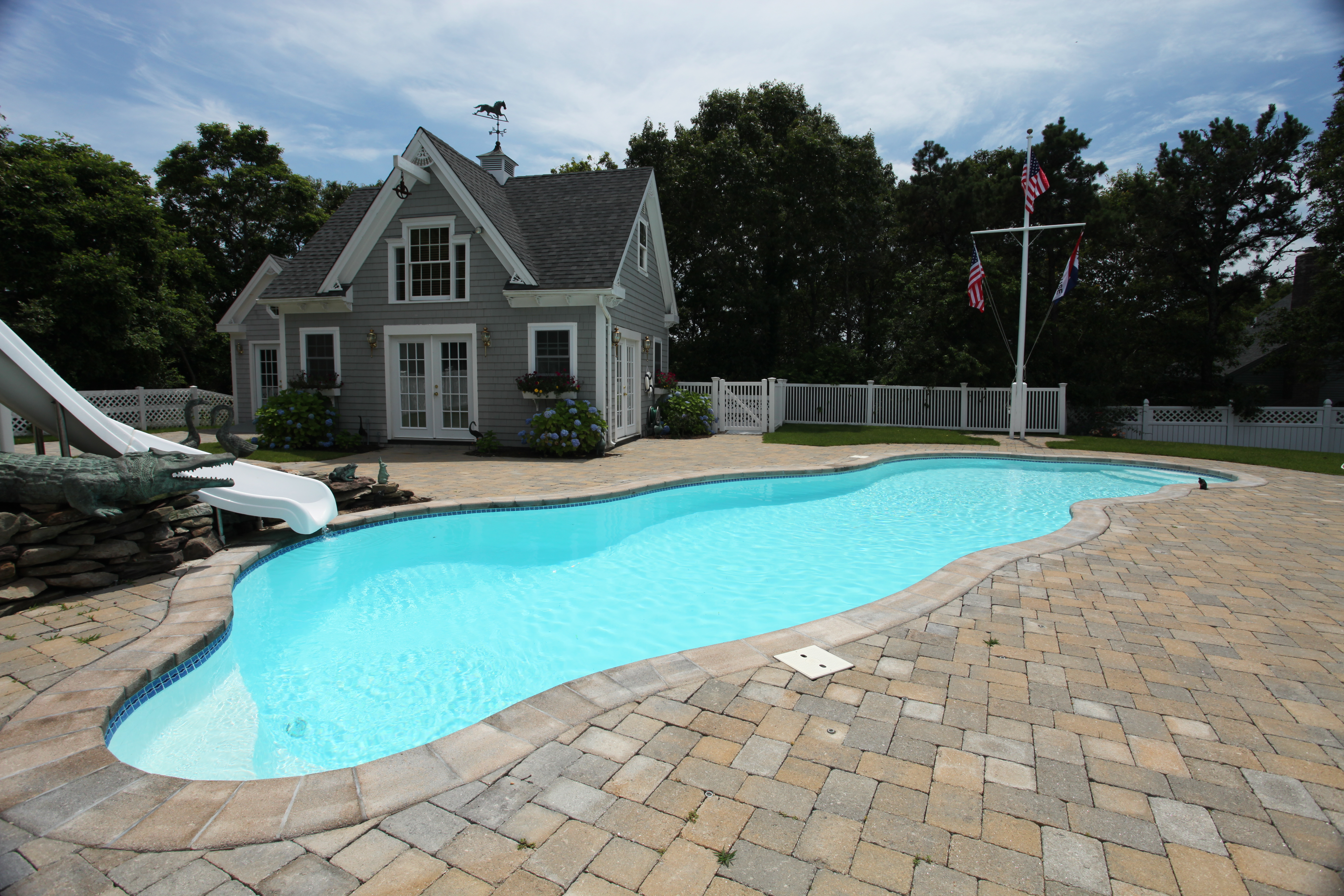 Enjoy the sunny serenity of our new fiberglass in-ground pool—perfect for a cool dip or a peaceful soak.