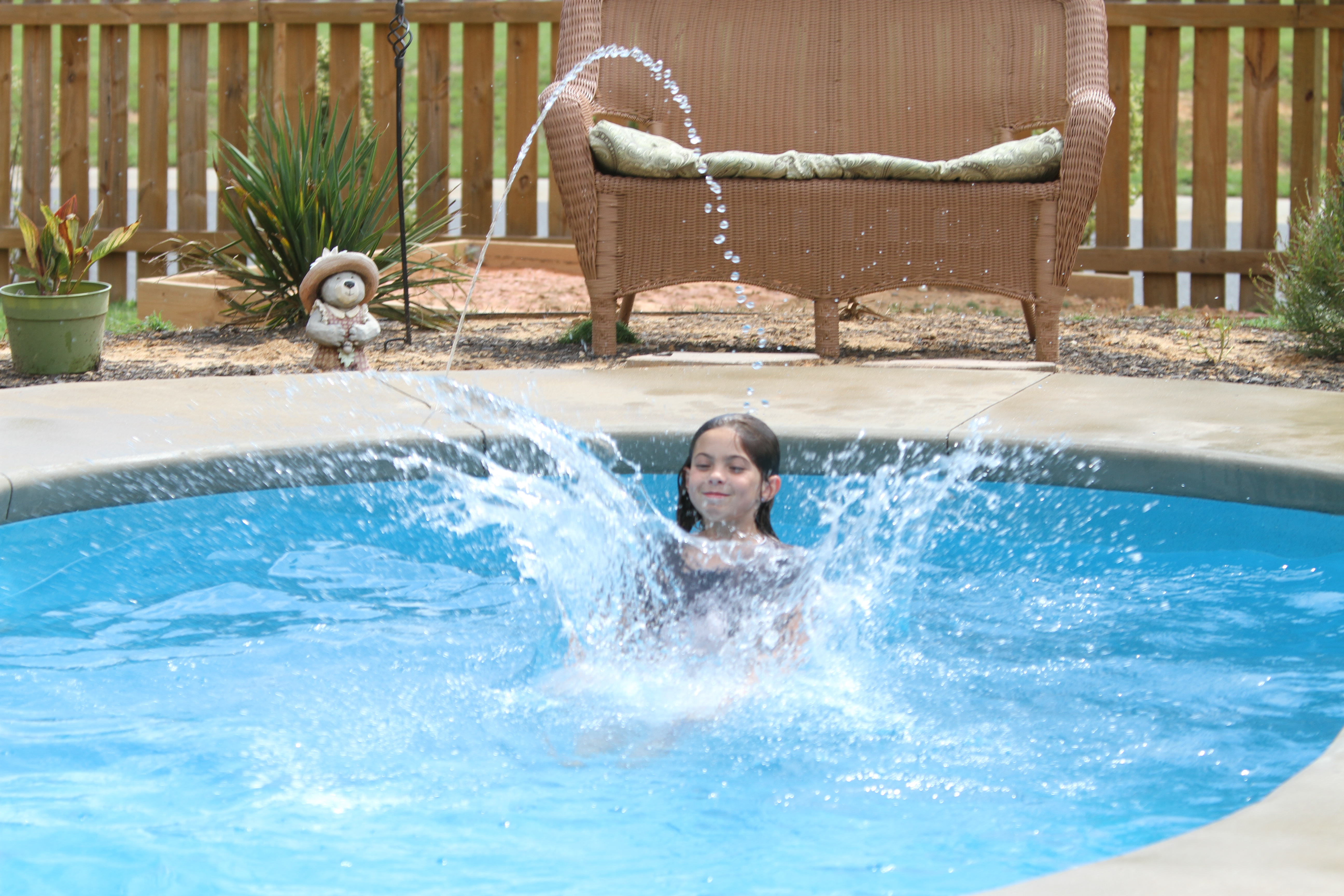 Dive into a sparkling fiberglass pool in your own backyard oasis, where warm sunshine meets cool water and playful moments await. Experience the ultimate blend of comfort and style with our durable fiberglass construction, perfect for summer family fun.