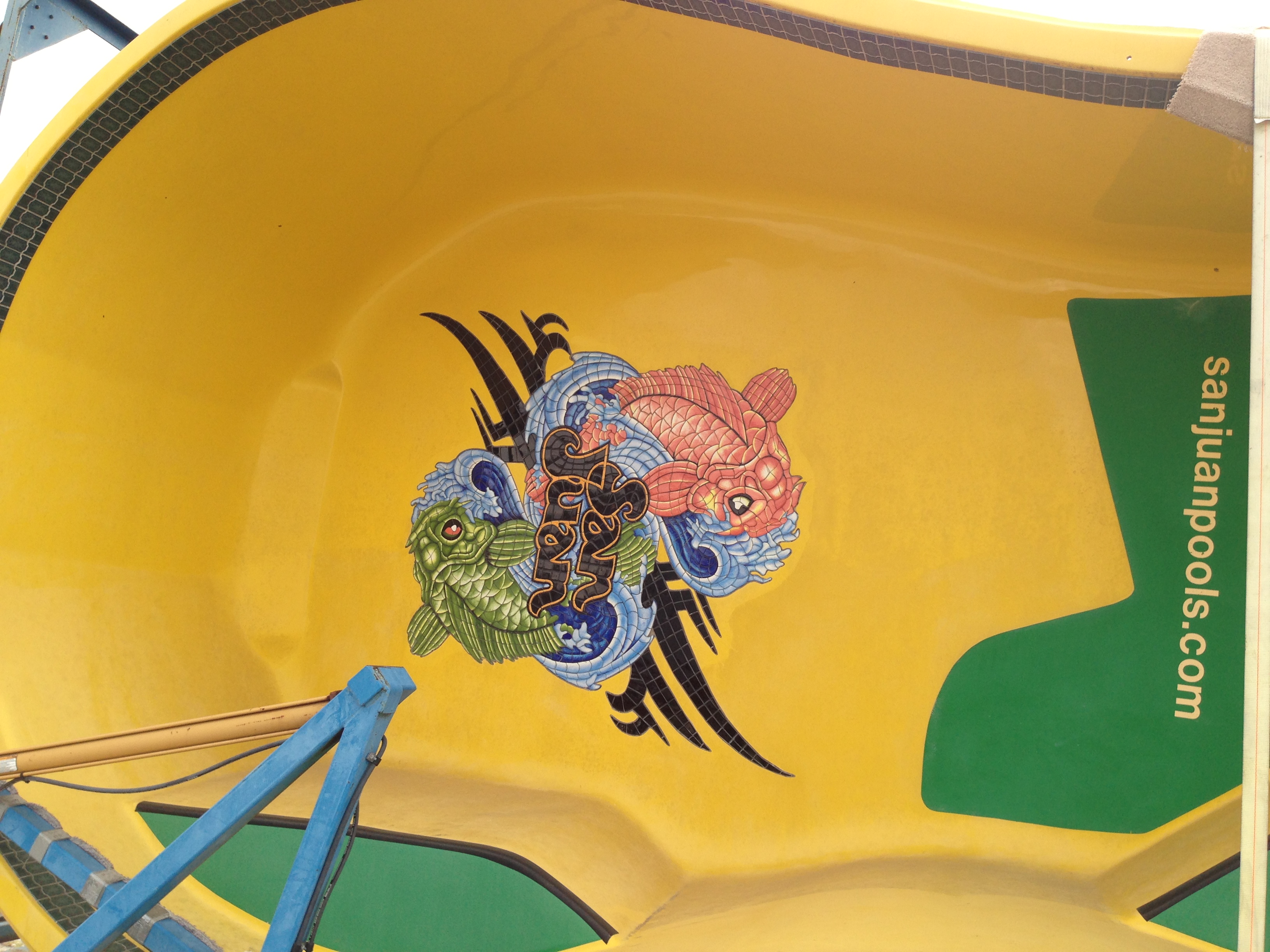 Dive into summer fun with this vibrant, fiberglass San Juan Pool featuring a playful fish design.