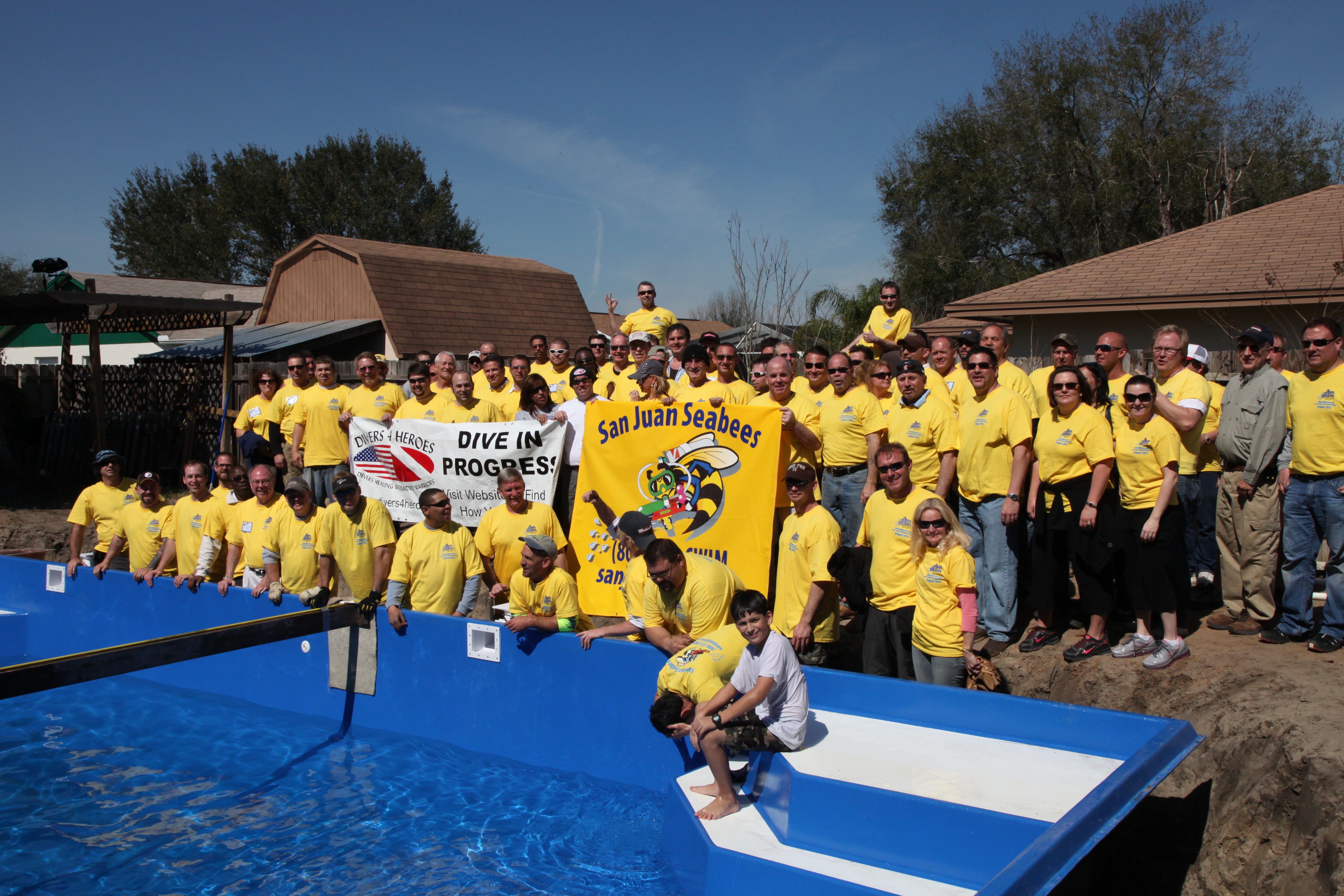 Enjoy a sunny community splash in this vibrant fiberglass pool, perfect for gatherings and summer fun.