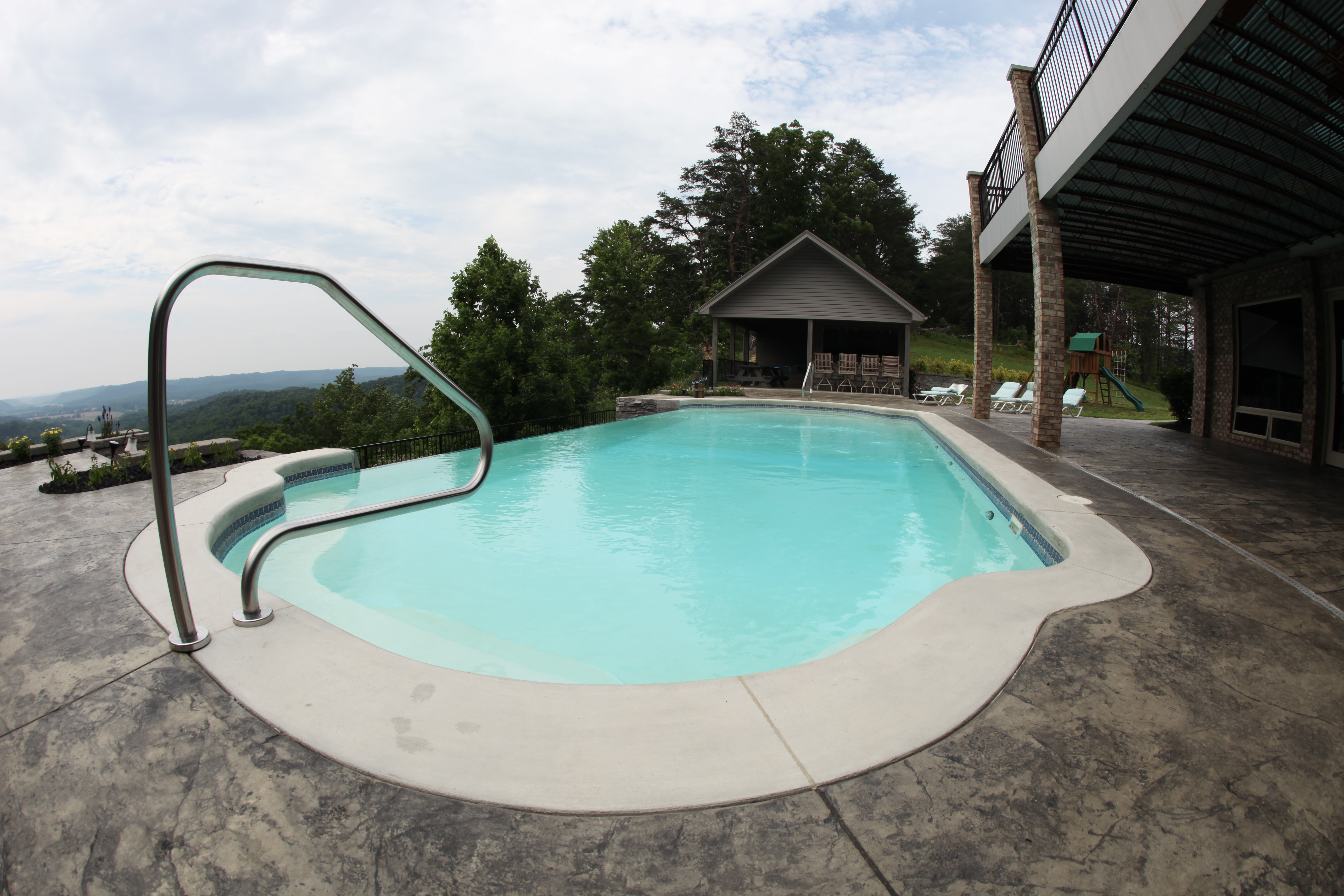 Experience tranquil luxury with this newly installed fiberglass kidney-shaped pool, set in a serene backyard oasis.