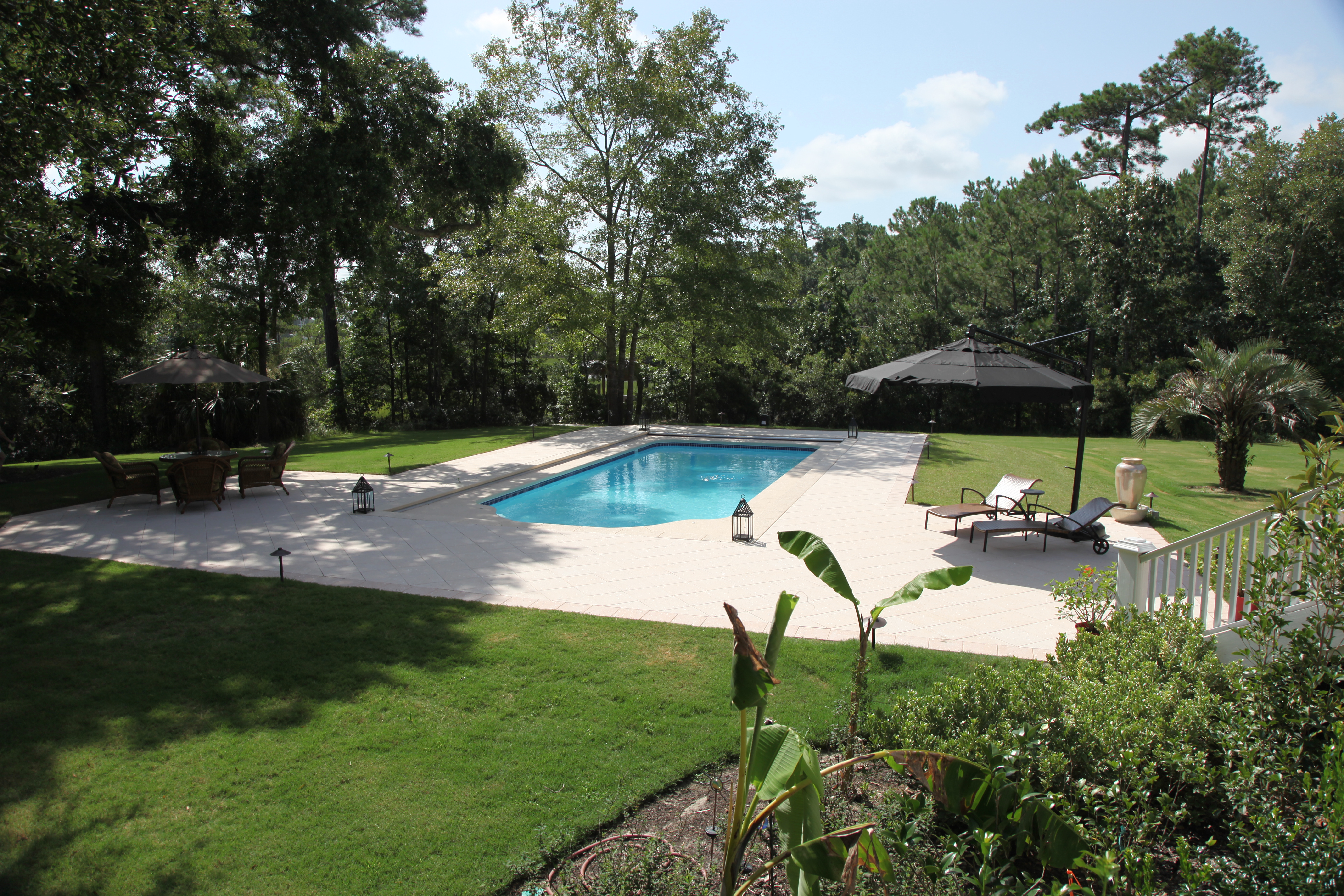 Discover the serene luxury of our fiberglass inground pool—an impeccable blend of crystal-clear water, modern design, and lush backyard surroundings.