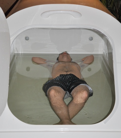 Experience serene relaxation in this sleek, white fiberglass spa, where crystal-clear water and soft lighting create a tranquil oasis.